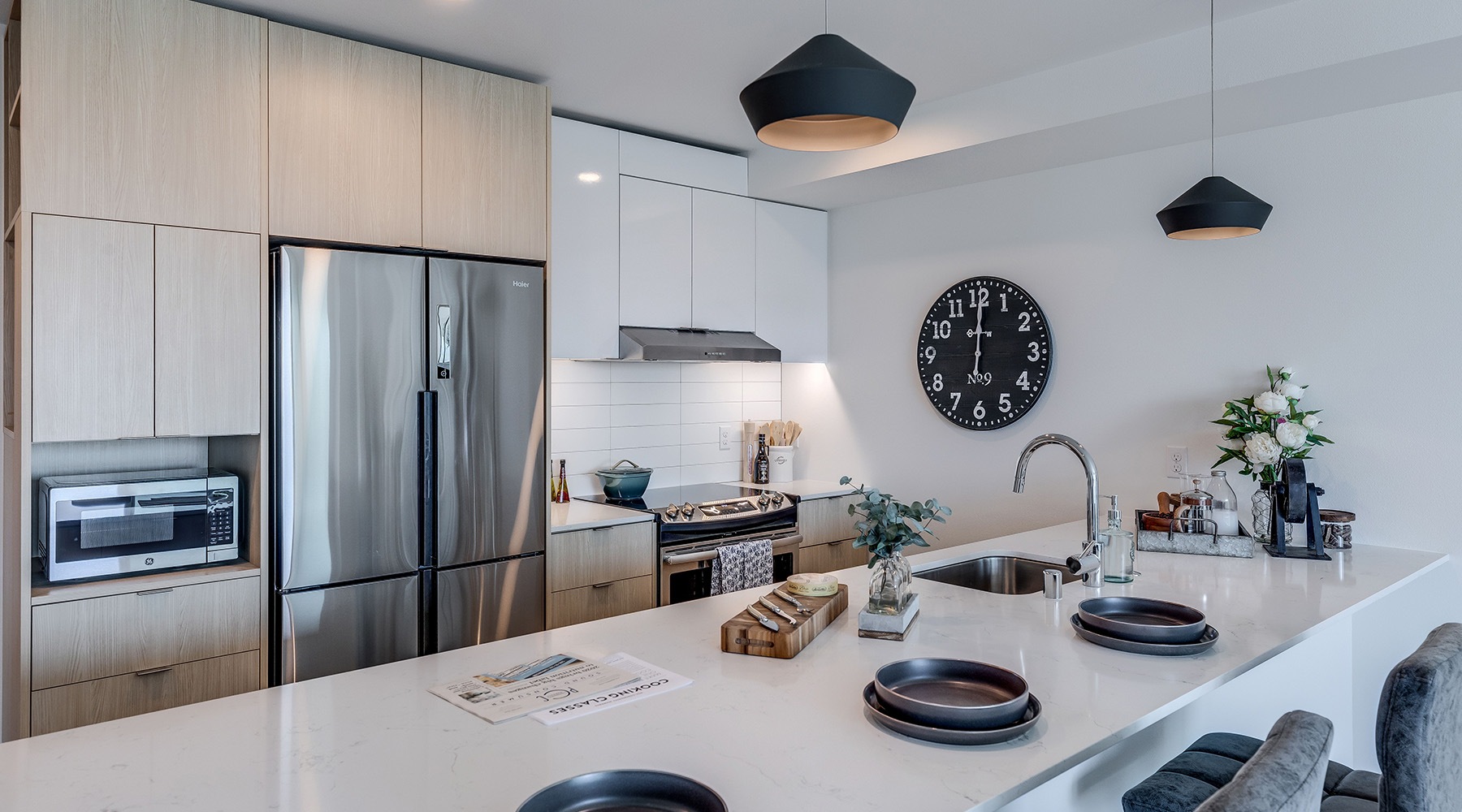 bright kitchen with plates and stainless steel appliances bright kitchen with plates and stainless steel appliances