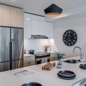 Settle into comfort at LUNA a kitchen with a large island